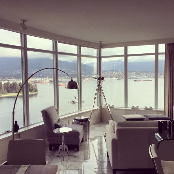 Full-height glass window with views from a condo